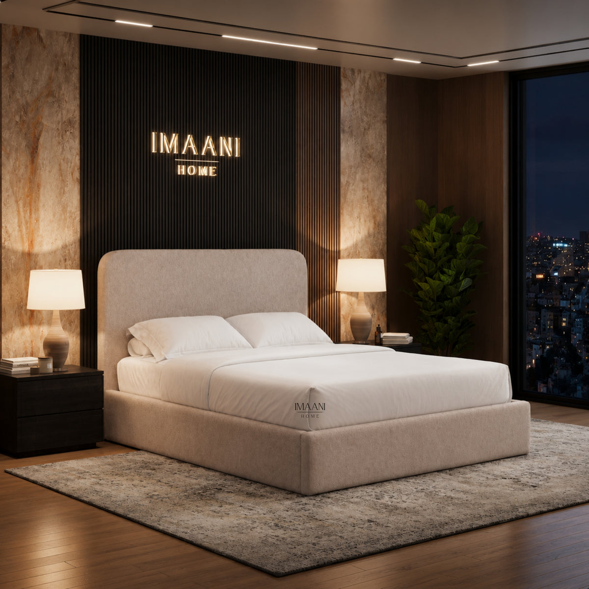 Three-quarter view of the Elara upholstered bed in light beige textured fabric with a softly rounded plain headboard, low padded footboard and smooth side rails.