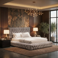 Three-quarter view of the Francesca Ambassador bed in light grey upholstery with a button-tufted headboard and chunky braided upholstered base.
