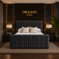 Front view of the Halston charcoal grey panel bed featuring a tall rectangular headboard with deep vertical padding and a matching vertically panelled footboard.