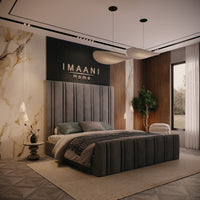 Three-quarter view of the Hope upholstered bed frame in taupe grey with a tall vertical-panel headboard, matching panelled footboard and plain upholstered side rails.
